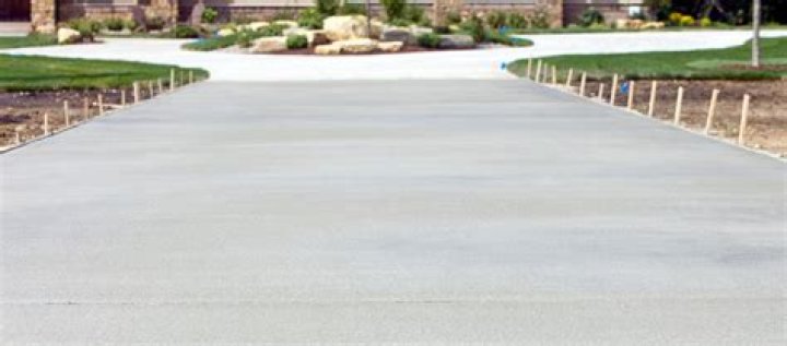 How thick should the base be for a concrete driveway?