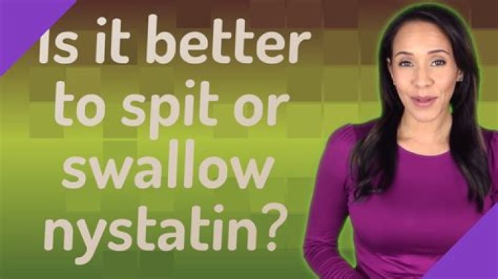Is it better to spit or swallow nystatin?