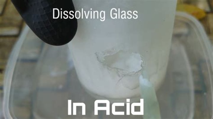 What acid eats glass?