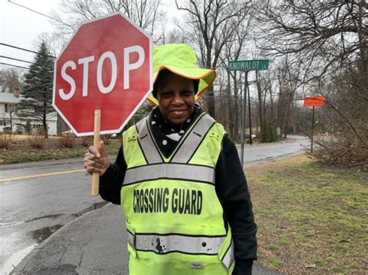 What is the role of a crossing guard?