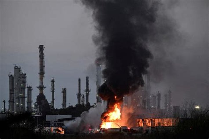 Who attacks the oil refinery in the Cay?